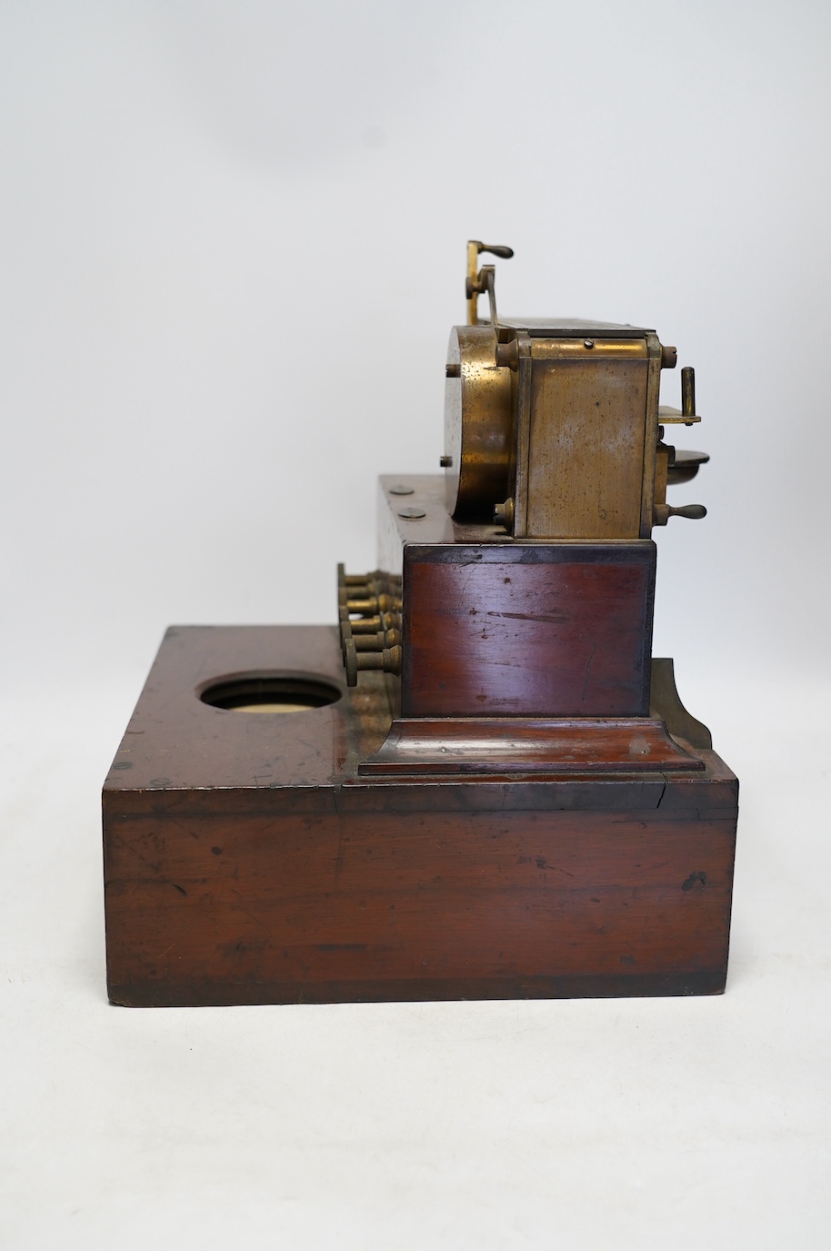 A late 19th century brass and mahogany Wheatstone type telegraph receiver (Morse inker), containing two drawers with paper rolls, 30cm high, 30cm wide, 28cm deep.